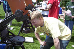 Ben checks the telescope's alignment.