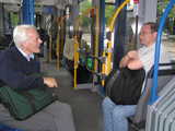 
discussions go on in the tram
