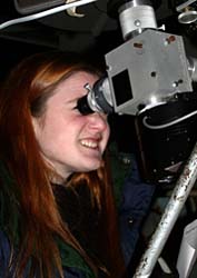 Junior astronomy student Robin Siskind counts Jupiter´s rings and tries to make out four of the planet´s moons during the university´s open house last week.