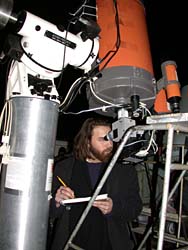 Astronomy undergraduate Brian Young observes Saturn through one of the university observatory's telescopes.