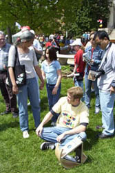 Eric demonstrates the SunSpotter to the crowd.