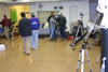 room filled with people and telescopes