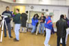 room filled with people and telescopes