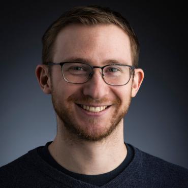 Joshua Lothringer; bearded man wearing glasses