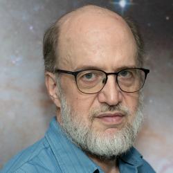 David Bennett; portrait against spacy background