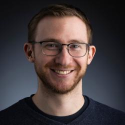 Joshua Lothringer; bearded man wearing glasses