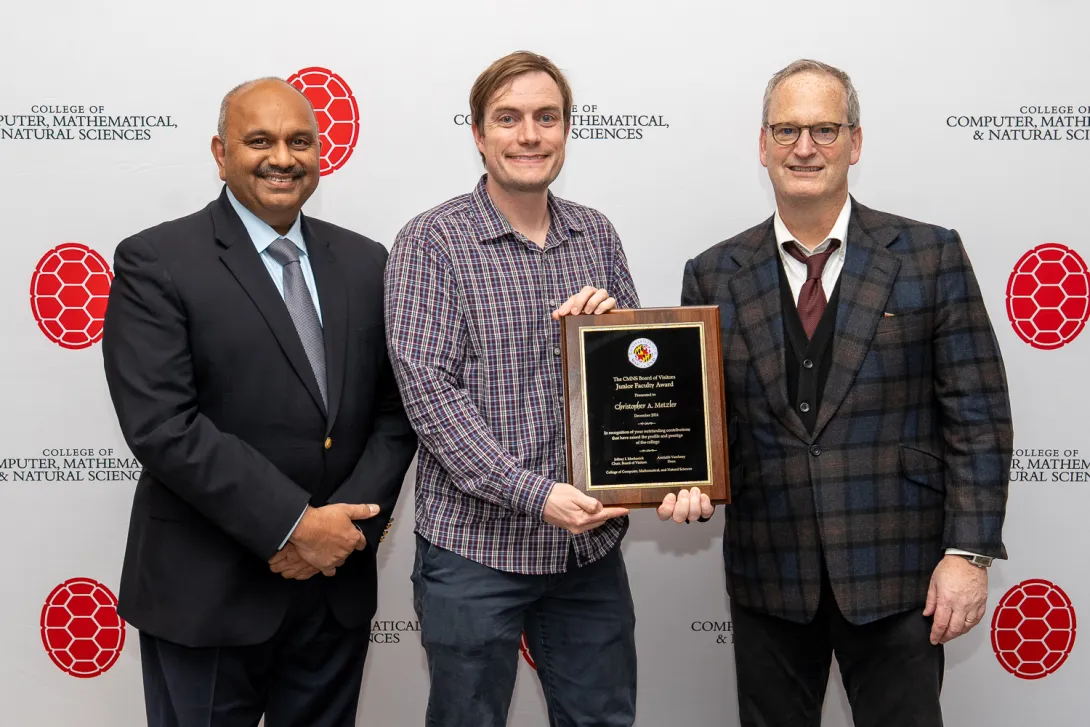 Amitabh Varshney, Christopher Metzler and Jeffrey Mechanick in front of CMNS branded backdrop