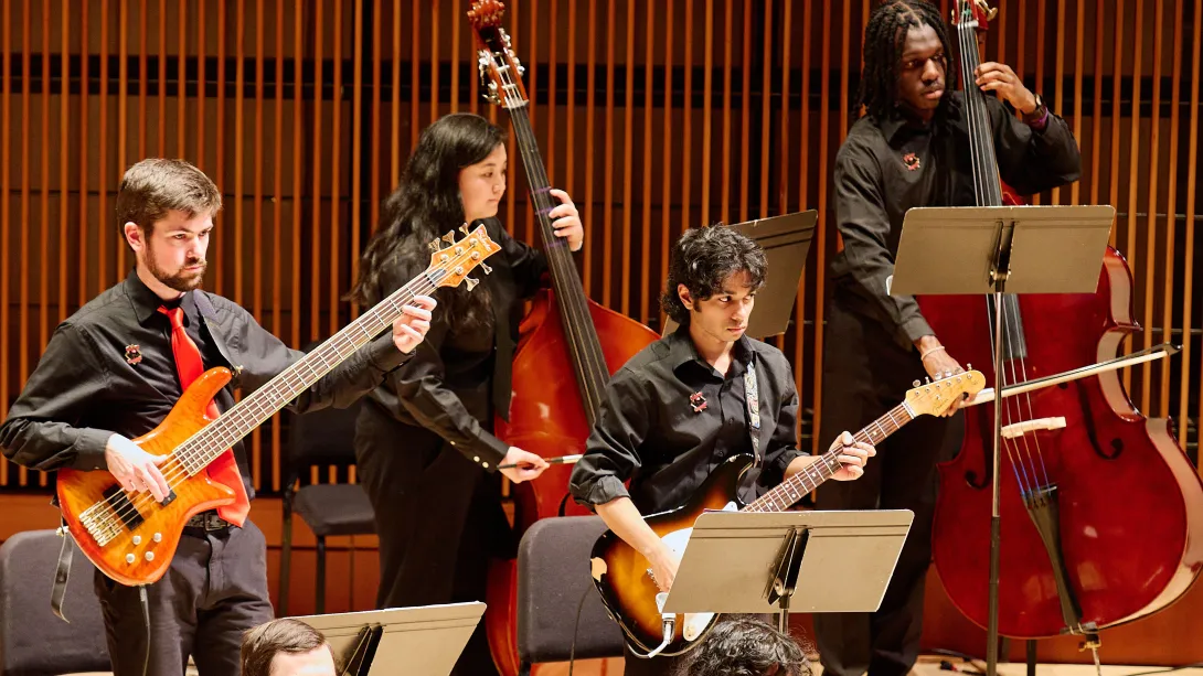 Musicians playing guitar and bass.